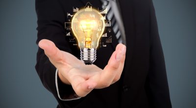 Business man holding light bulb Business man holding light bulb